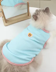 Detailed view of breathable waffle knit pet vest with cute bear embroidery and pink trim.