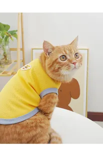Detailed view of breathable yellow pet vest with grey trim, soft summer cat tank top.