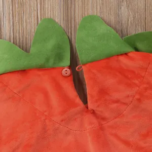 Close-up detail of the cute baby pumpkin costume collar with green leaf design and button.