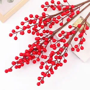 Detailed view of artificial red berry branches, ideal for home decor and floral arrangements.