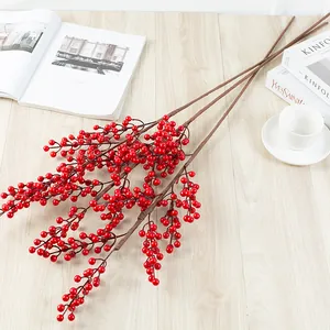 Artificial red berry branches detail, fake winterberry for home decor and holiday arrangement.