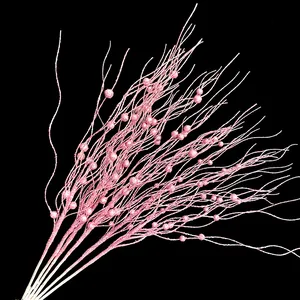 Detailed close-up of sparkling pink glitter berry branches for Christmas tree decoration