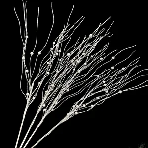 Detailed view of silver glittery Christmas berry branches for festive tree decoration.