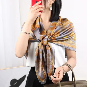 Elegant square silk scarf with luxury camellia floral print, ideal for spring and autumn fashion.