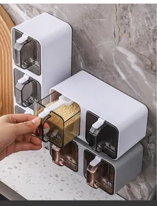 Close-up detail of wall-mounted seasoning box set with drawer being pulled out
