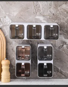 Wall-mounted seasoning boxes with multiple compartments for spice storage.