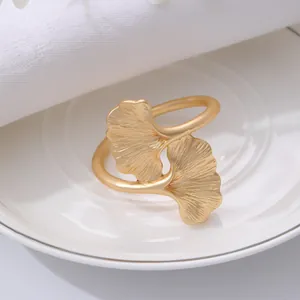 Gold ginkgo leaf napkin ring metal napkin holder for luxury hotel table decor detail view