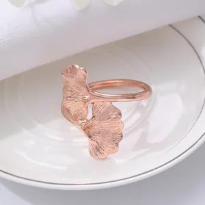 Rose gold ginkgo leaf napkin ring, elegant table decor detail for dining room and hotel.