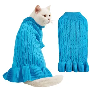 Cozy blue cable-knit pet sweater with stylish ruffles, perfect warm winter clothing for cute cats.