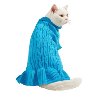 Detailed view of the blue cable knit pet sweater with adorable ruffle hem showing texture.