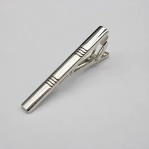 Silver metal tie clip for men, classic business tie bar with elegant textured design.