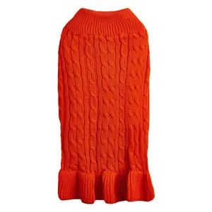 Close-up detail of the orange cable-knit pet sweater with cozy turtleneck and a cute ruffled hem.