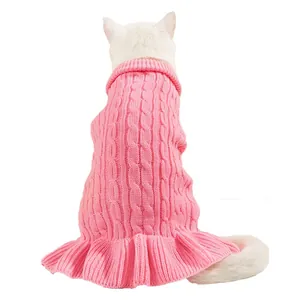 Close up detail of cute pink cable knit pet sweater with ruffled hem for small dogs cats.
