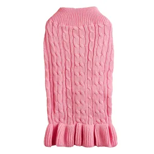 Pink cable knit pet sweater detail, close-up of warm puppy clothes with lovely ruffles.