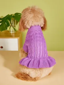 Detail shot of a purple knitted cable sweater for small dogs, featuring a cute ruffled hem.