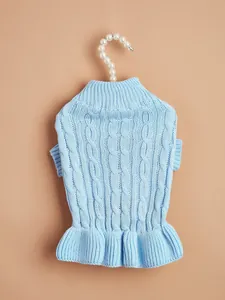 Light blue cable knit pet sweater detail, featuring a cozy turtleneck and cute ruffled hem.