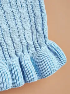 Light blue cable knit dog sweater detail view, soft cozy pet apparel texture closeup.