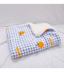 Blue and white checkered plush pet mat with cute orange embroidery for winter warmth.