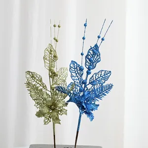Glitter artificial Christmas tree branch detail, sparkling berry and leaf floral decor.