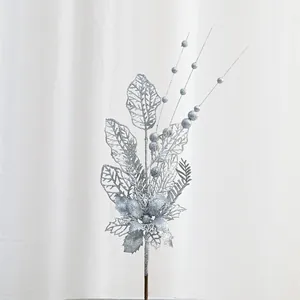 Silver glitter artificial Christmas branch detail, sparkling berry and leaf floral pick decor.