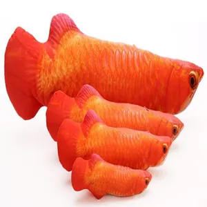 Close-up detail of plush fish toy showing realistic scale print and soft stuffed design.