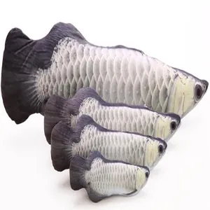 Close up detail of four soft plush fish cat toys in varying sizes with realistic scale print.