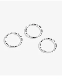 Close-up detail of three minimalist 999 solid silver plain rings showcasing fine texture