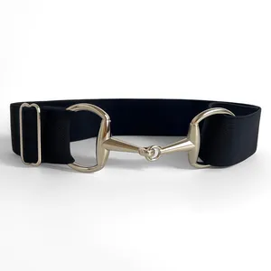 Detailed view of the black elastic waist belt featuring a luxury gold horsebit buckle close-up