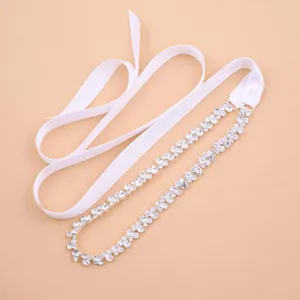 Detailed view of the sparkling rhinestone bridal belt with elegant white satin ribbon.