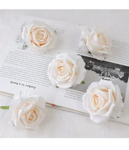 Artificial rose flower heads for DIY crafts, wedding decoration, and floral arrangements.
