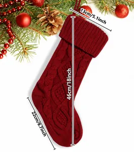 Macro detail showing dimensions of a large red cable knit Christmas stocking gift bag.