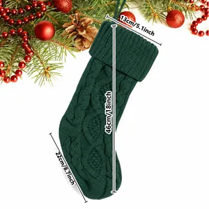 Detailed green cable-knit Christmas stocking with 18-inch length size measurements