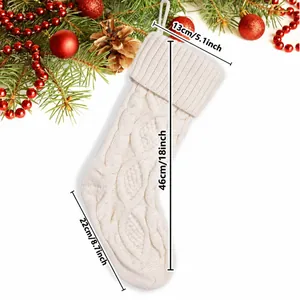 Detailed dimensions of a large white knitted Christmas stocking with diamond pattern.