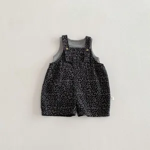 Detailed shot of infant leopard print overalls set, gray tank top and shorts, baby detail view