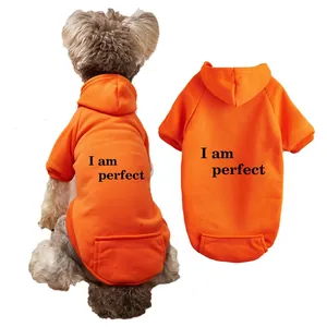 Orange fleece pet hoodie detail showing back print design and warm winter dog apparel.