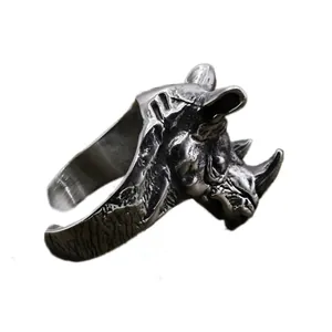 Detailed shot of vintage punk rhinoceros head ring, adjustable metal band, intricate texture.