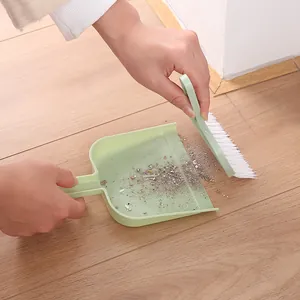 Mini juego de limpieza de escritorio pequeña pala y escoba combinado para uso doméstico.