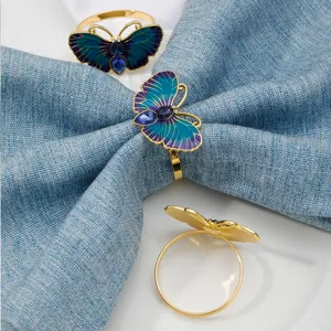 Exquisite butterfly napkin ring featuring vibrant blue enamel wings and sparkling crystal details.