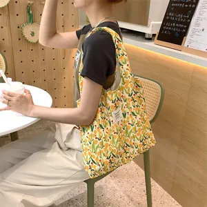 Cute floral canvas tote bag for women, large capacity shoulder handbag for daily college classes.