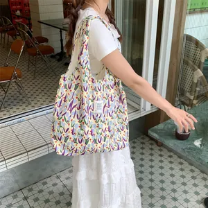 Floral canvas tote bag with large capacity, cute tulip pattern, perfect for daily use and school.