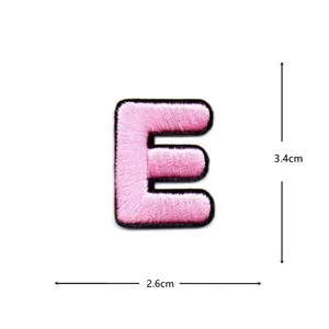 Pink embroidered letter E patch, clothing accessory for DIY repair and decoration.