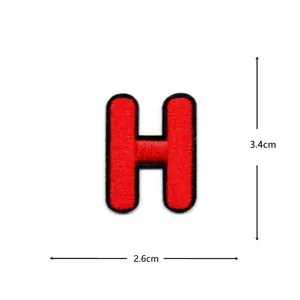 Detail shot of a red embroidered letter H patch with black border, showing size 2.6x3.4cm.