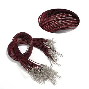Dark red waxed cord necklace detail view with silver lobster clasp and extension chain.