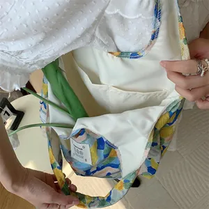 Summer floral canvas tote bag detail view, casual large capacity aesthetic shopping handbag.