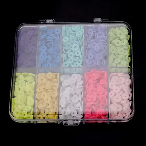Colorful flat clay beads in a clear storage box, perfect for DIY jewelry making details.
