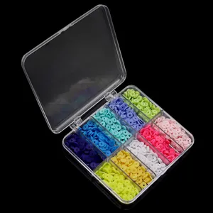 Clear plastic storage box filled with colorful clay beads for DIY crafts and jewelry making.