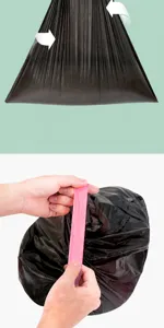 Close-up detail of the pink widened drawstring on a heavy-duty black garbage bag