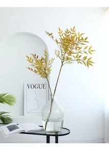 Artificial Nandina branch fake green plant for home decor interior landscaping detailing view.