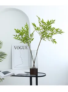 Artificial single branch nandina bamboo for home decor, realistic green plant detail view.