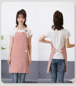 Front and back views of a red and white striped waterproof kitchen apron with pockets